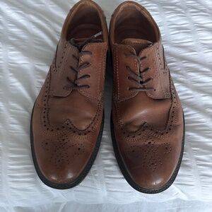 Brown leather wingtip shoes